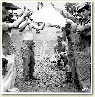 RELAXING AFTER CORREGIDOR ON MINDORO, TROOPERS OF THE 503d PRCT 'RE-ENACT' THE WILDCAT PATCH